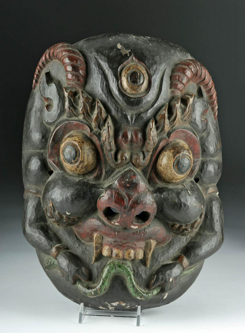 Early 20th C. Indonesian Wooden Festival Mask: **First Time At Auction** Indonesia, Bali or Java, ca. early 20th century CE. A wonderful wooden festival mask, hand-carved with bulging eyes, an upturned nose with large nostrils, three stylized eyes