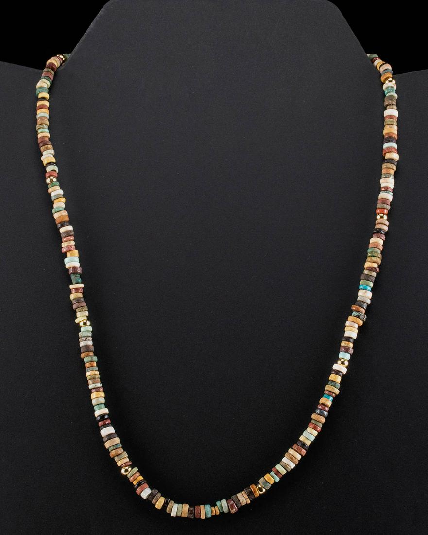 Egyptian Faience Bead Necklace: Ancient Egypt, Third Intermediate to Late Dynastic Period, 21st to 31st Dynasty, ca. 1070 to 332 BCE. A fabulous necklace comprised of over 200 ancient faience beads. The beads are a primarily disc an