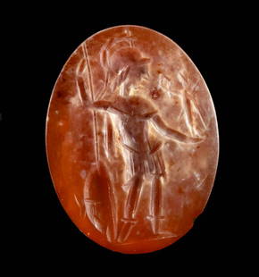 Roman Carnelian Intaglio w/ Minerva: Roman, Imperial Period, ca. 1st to 3rd century CE. An ovoid carnelian intaglio engraved with a profile image of Minerva, the goddess of wisdom and warfare. She stands with a spear in her left hand, a