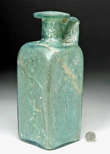 Huge Roman Green Glass Jug - from Cologne: Roman, Imperial Period, ca. 2nd to 3rd century CE. A HUGE and I mean HUGE - one cannot emphasize the generous size of this vessel enough - translucent glass jug presenting stunning pale, aqua hues.