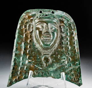 Egyptian Ptolemaic Bronze Ornament of Deity: Ancient Egypt, Ptolemaic period, ca. 332 to 305 BCE. A lovely bronze repousse ornament of rounded form featuring a central head of an Egyptian god or goddess, possibly Hathor, the goddess of music,