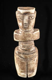 Egyptian Coptic Bone Female Idol: Egypt, Coptic culture, ca. 5th to 7th century CE. A delightful female idol carved from a hollowed-out bone, probably from livestock or a small wild ungulate, made in Byzantine Egypt. The figure