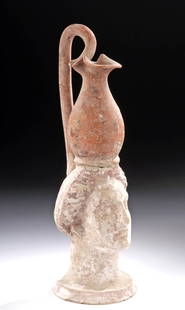 Greek Canosan Polychrome Oinochoe w/ Female Head: Magna Graecia, Southeast Italy, Canosan, ca. 350 to 250 BCE. An elegant vessel presenting a portrait bust of a female visage with very naturalistic features, her delicate face presenting large
