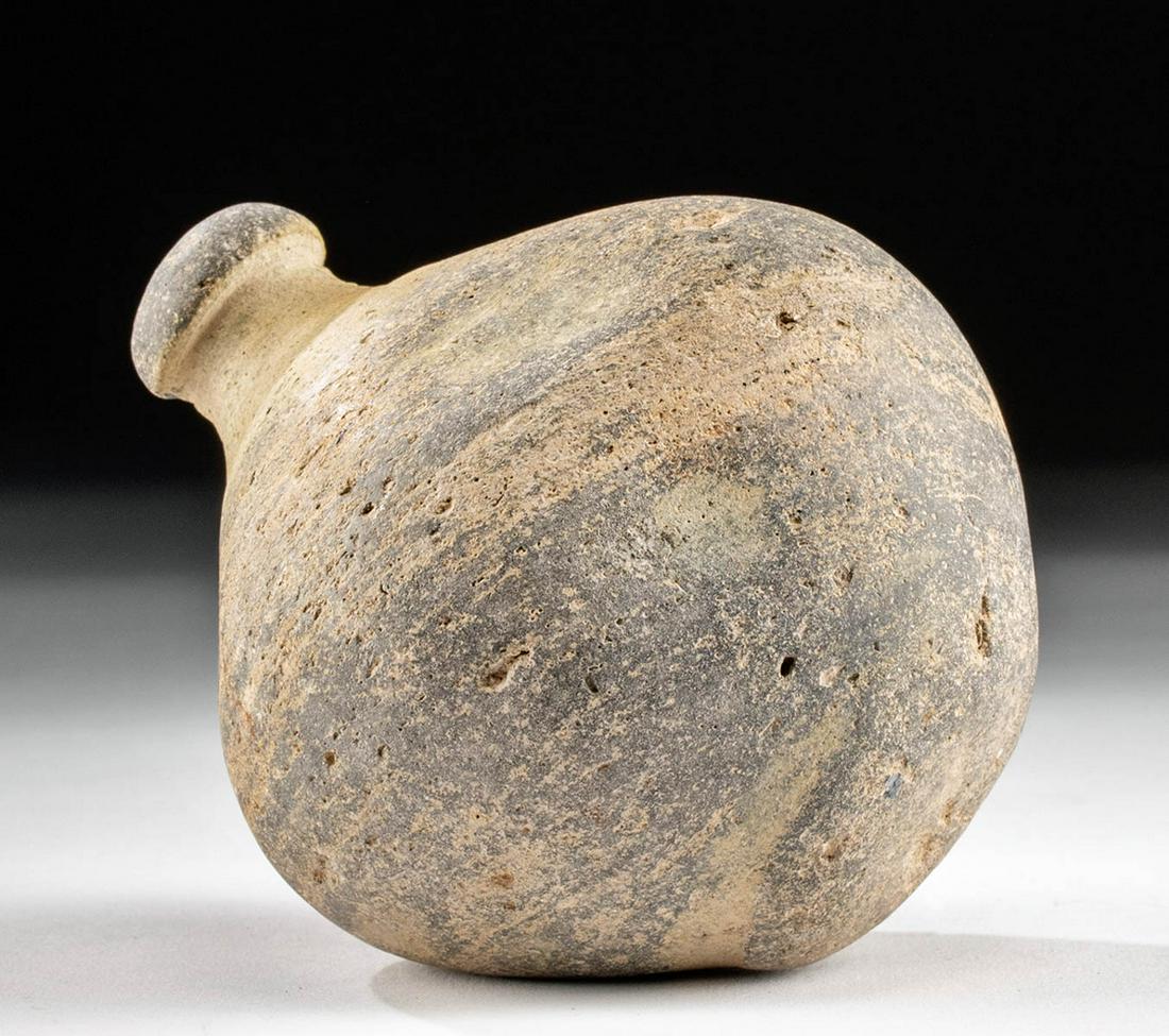 8th C. Byzantine Terracotta Hand Grenade - "Greek Fire": Ancient Near East, Holy Land, Byzantine Empire, ca. 8th to 10th century CE. A fine terracotta hand grenade with a round base, a spherical body with a couple of shallow indentations, a sloped shoulder,