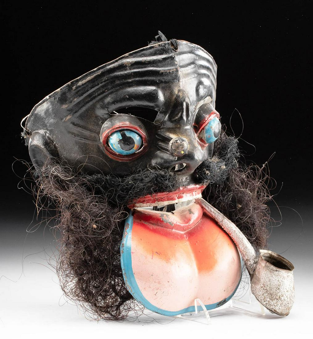20th C. Bolivian Tin Moreno Mask: 100% of the Buyer's Premium of all lots sold in this auction will be donated to Community Food Share by Artemis Gallery. $1.00 = 3 meals! **First Time At Auction** Western/central South America, Bo