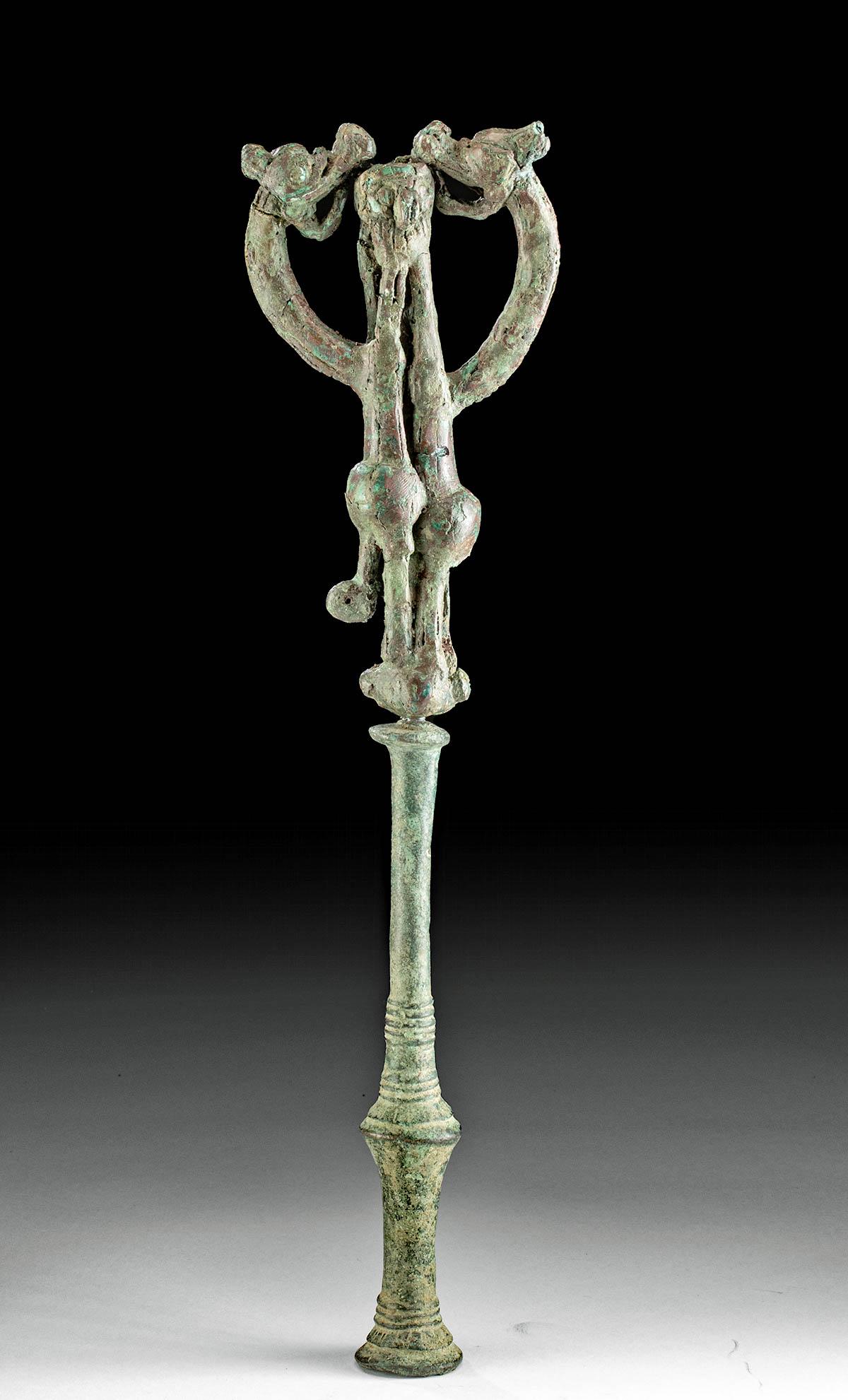 Luristan Bronze Master of Animals Finial: **First Time At Auction** Ancient Near East, northwestern Iran, Luristan, ca. 1000 to 600 BCE. A lovely bronze tubular standard in the form of a "master of animals," composed of two separate pieces; w