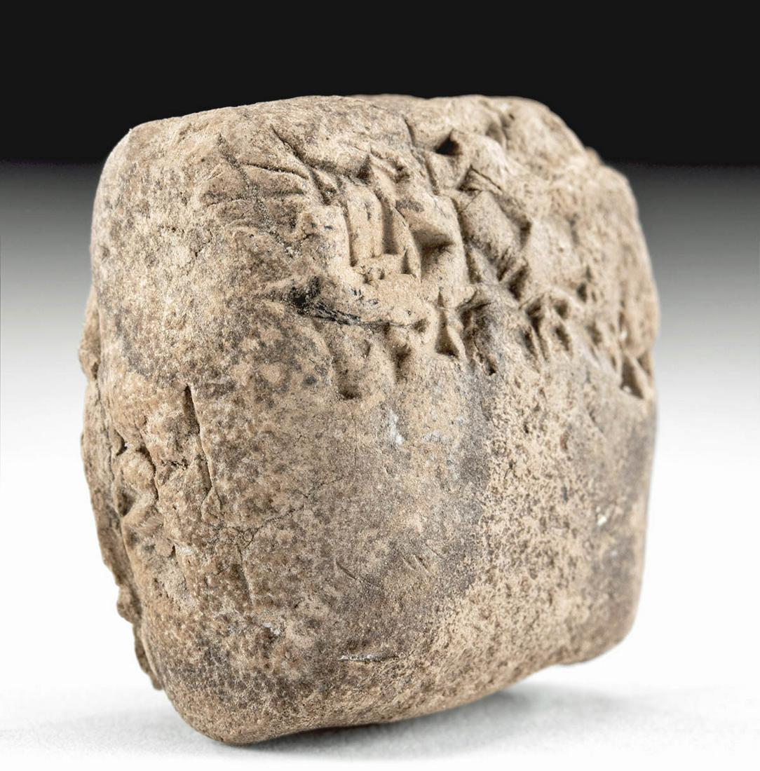 Babylonian Clay Cuneiform Tablet & Envelope Fragment: **Originally Listed At $200** Ancient Near East, Mesopotamia, Babylon, Old Babylonian Period, ca. 1900 to 1700 BCE. A hand-built clay administrative tablet of a rectangular form containing a few lines