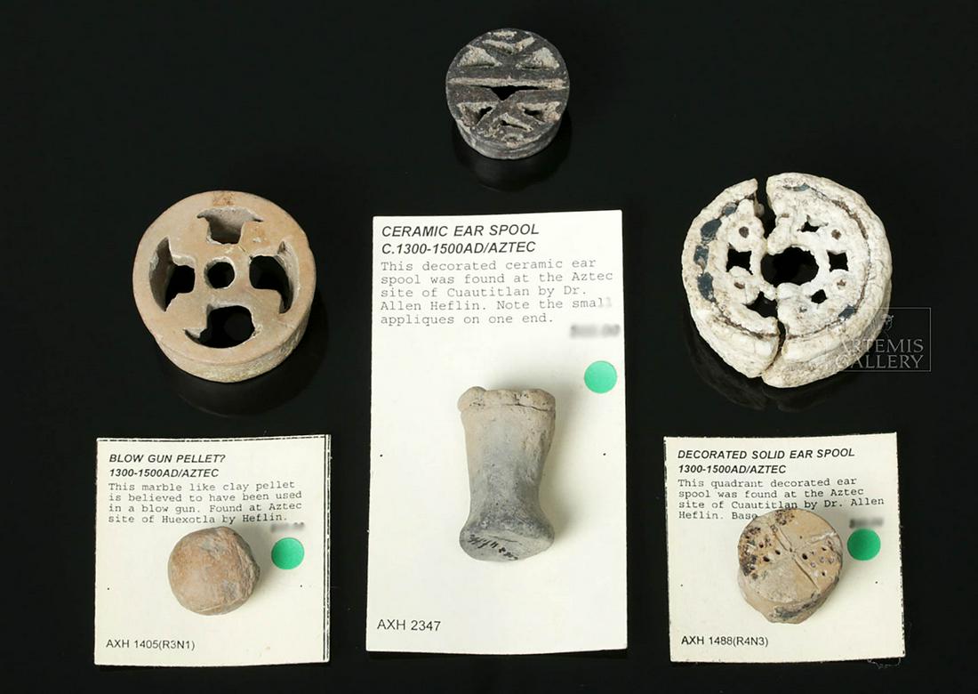 Lot of 5 Aztec Ceramic Ear Spools & Blowgun Pellet: **Originally Listed At $200** Pre-Columbian, Mexico City region, Aztec, ca. 1300 to 1500 CE. A collection of five ceramic ear spools and one ceramic pellet from a blow gun. Three of the spools are ope