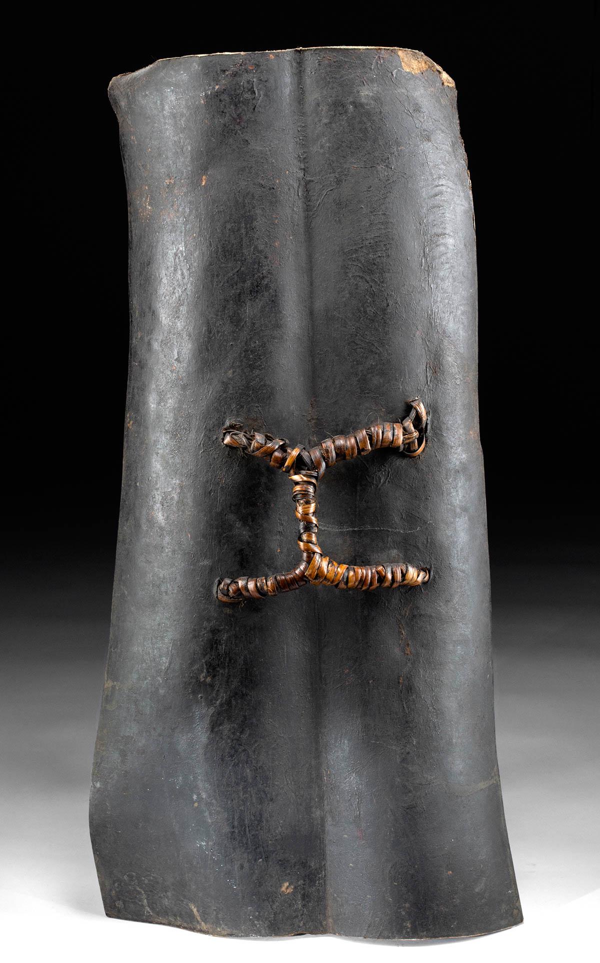 Early 20th C. Southern Sudan Toposa Hide Shield: **Originally Listed At $300** Central Africa, South Sudan, Toposa people, ca. early 20th century CE. A shield made of animal hide - probably sheep or goat or a young cow - with curved edges and a thic