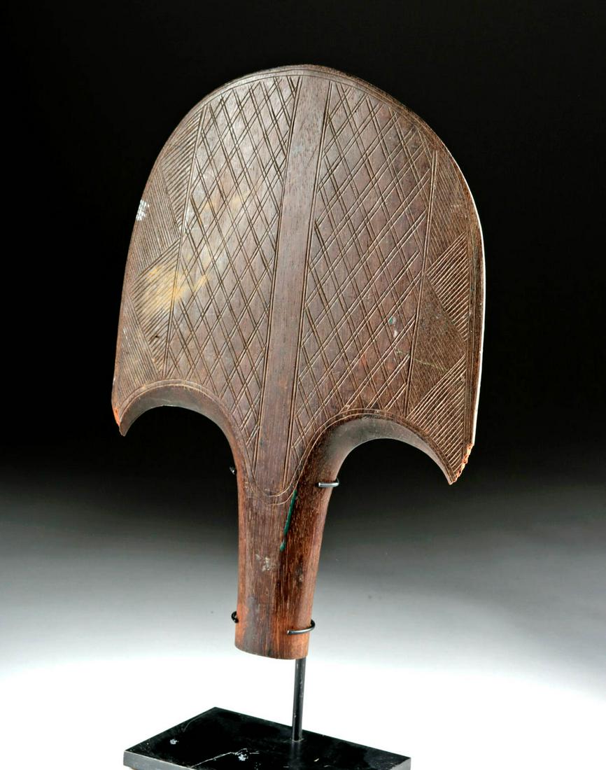Early 20th C Trobriand Island Incised Wood Paddle Blade: **Originally Listed At $400** Oceania, Papua New Guinea, Trobriand Islands, ca. early 20th century CE. A hand-carved wooden paddle blade of an anchor-like shape with an extensive incised decorative pr