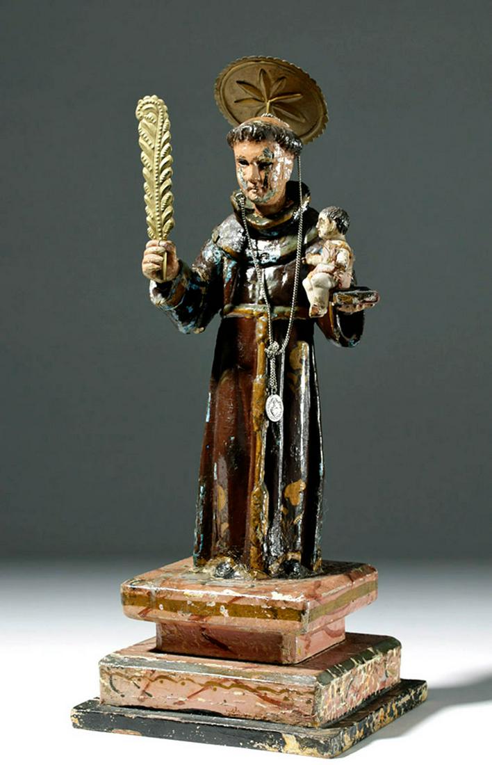 19th C. Spanish Colonial Santo - St. Anthony of Padua: **Originally Listed At $1000** New World, Spanish Colonial, Mexico, ca. early 19th century CE. A hand-carved wooden santo with glass eyes, depicting St. Anthony of Padua. In one hand, he holds a book 