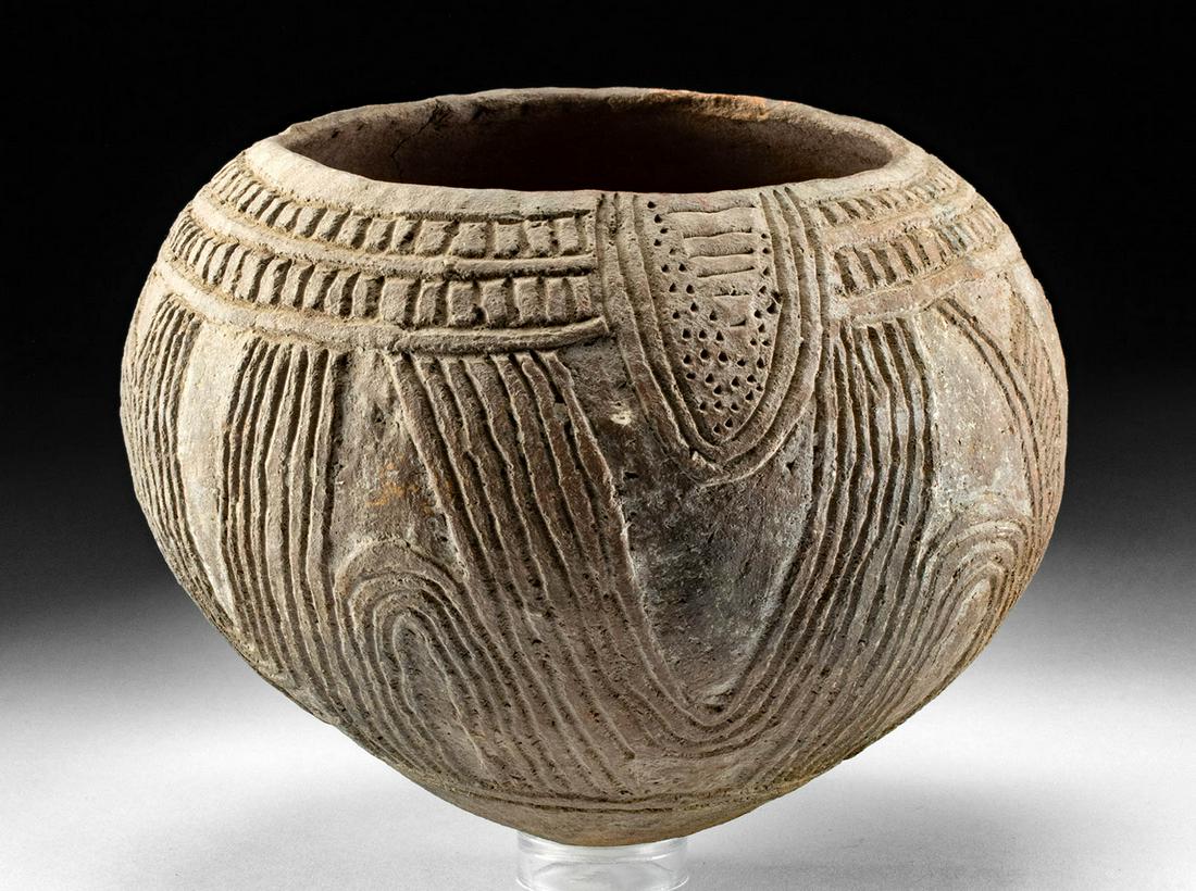 Early 20th C. Papua New Guinea Incised Pottery Bowl: Oceania, Papua New Guinea, West Sepik River region, ca. early 20th century CE. A hand-built earthenware bowl with a hemispherical form that is comprised of a rounded bottom, a deep basin, and a thick 