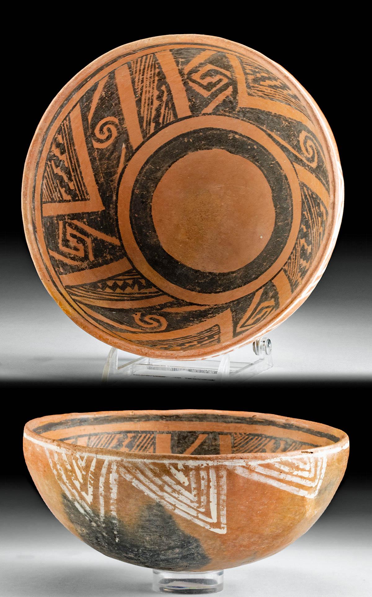Anasazi St. John's Polychrome Pottery Bowl: Southwestern USA, east central Arizona/west southern New Mexico, Ancestral Puebloan (Anasazi)/Mogollon culture, ca. 1175 to 1325 CE. A lovely redware pottery bowl of hemispherical form presenting a ro