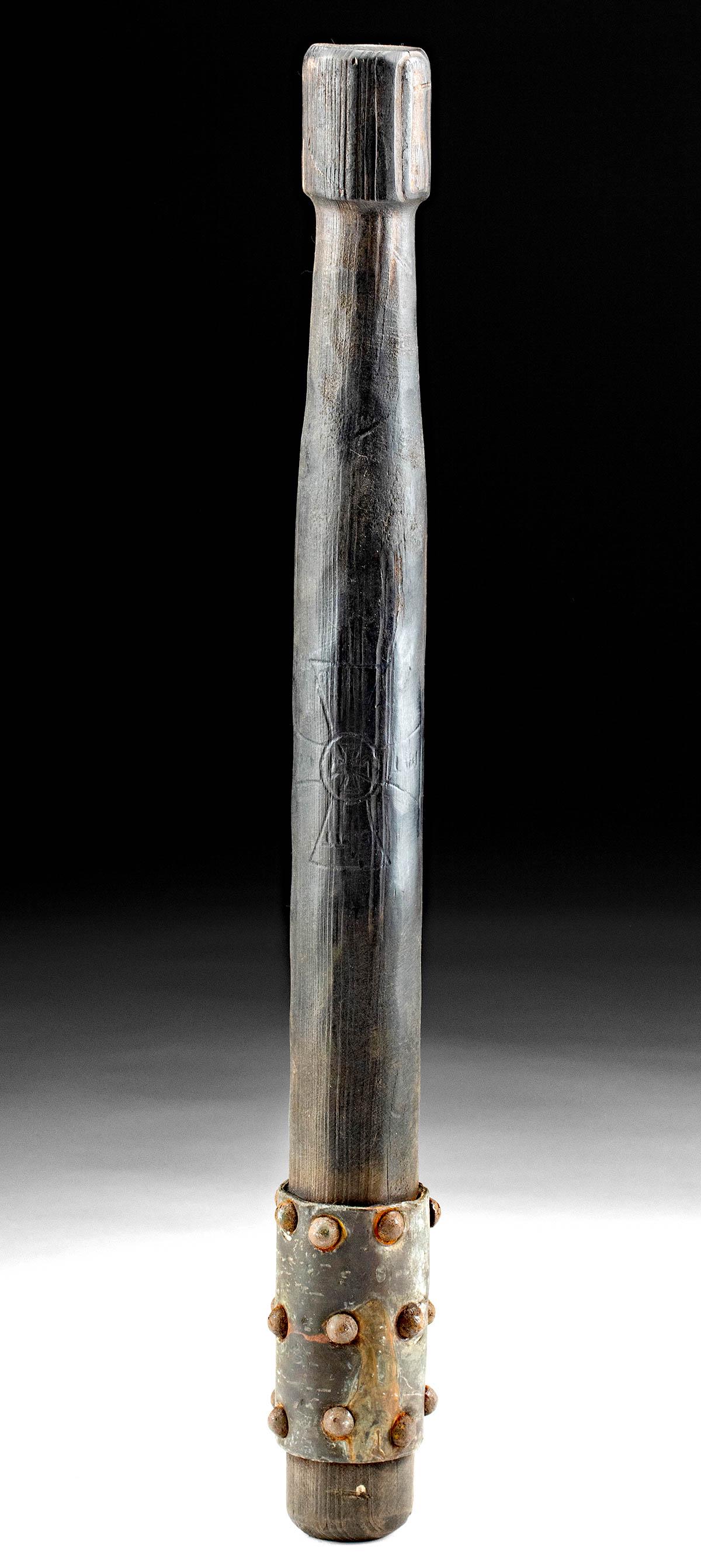 WWI German Wood & Iron Trench Club w/ Carved Iron Cross: Western Europe, Germany, ca. 1914 to 1918 CE. A deadly weapon with a wooden handle and an iron strip with three rows of seven rivets driven through the middle. The handle has a rounded head and engrav
