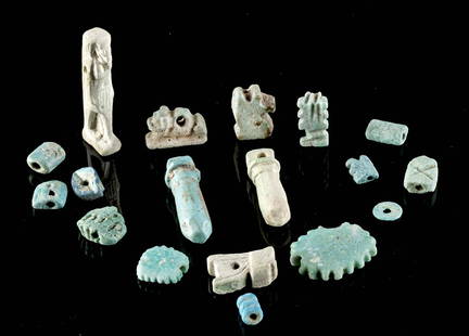 18 Egyptian Glazed Faience Amulets / Beads: Ancient Egypt, Third Intermediate to Late Dynastic Period, 21st to 31st Dynasty, ca. 1070 to 332 BCE. A wonderful selection of faience beads covered in layers of blue and blue-green glaze. First is a