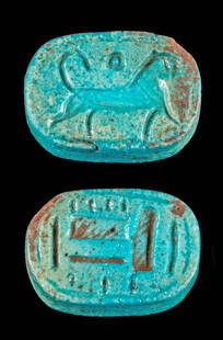 Egyptian Faience Amulet w/ Lion, Ex-Mitry: Ancient Egypt, New Kingdom Period, 18th to 20th Dynasty, ca. 1550 to 1070 BCE. A intriguing faience stamp seal bead of an oval shape with two flat faces presenting a lion on one side and a hieroglyph