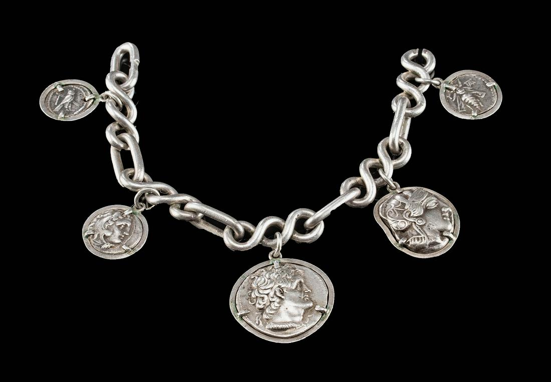Ancient Greek Silver Coins on Silver Bracelet: Greece / Egypt / Phoenicia, Athens / Macedonia / Alexandria / Aradus / Tyre, ca. 449 to 156 BCE. A stunning, high quality silver bracelet comprised of five ancient Greek silver coins, each framed with