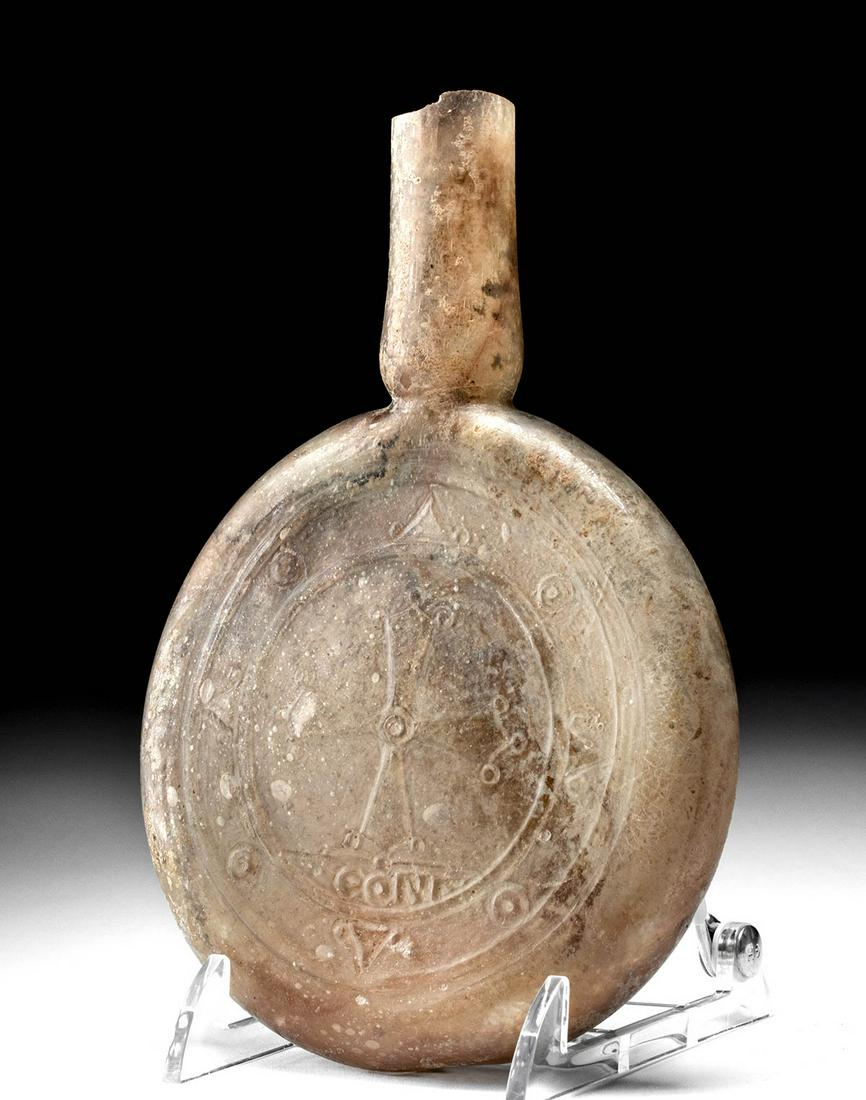 Rare Byzantine Molded Glass Pilgrim's Flask Inscribed: Byzantine Empire, Constantinople, ca. 800 to 1200 CE. An exceedingly rare glass pilgrim's flask in lozenge form with tall thin neck, flared rim now missing from age. Most fascinating is how this was m