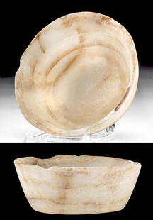 Egyptian Late Dynastic Alabaster Offering Bowl: Egypt, Late Dynastic Period, 26th to 31st Dynasty, ca. 664 to 332 BCE. A fine offering bowl carved from alabaster with a flat, annular base, gradually expanding walls, and a thick rim surrounding the