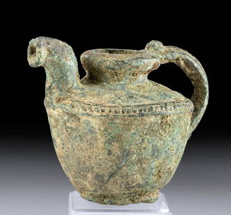 Hellenistic Greek Bronze Pitcher - Nicely Decorated: Greece, Hellenistic Period, ca. late 4th to 1st century CE. A lovely bronze pitcher displaying a circular foot, outward sloping body, flat shoulder, and a brief neck leading to a circular rim, curved