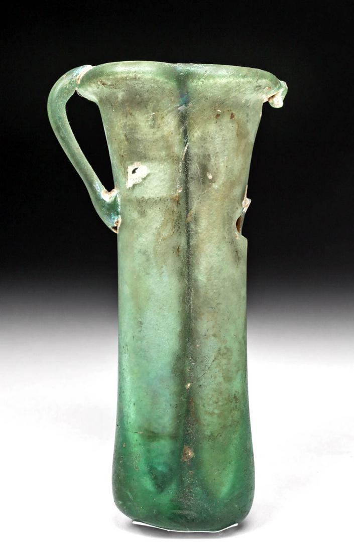 Roman Glass Double Unguent: **Originally Listed At $200** Roman, Imperial Period, ca. 2nd to 3rd century CE. A gorgeous free-blown double unguentarium, formed from an emerald-green glass, comprised of two tubes conjoined at the