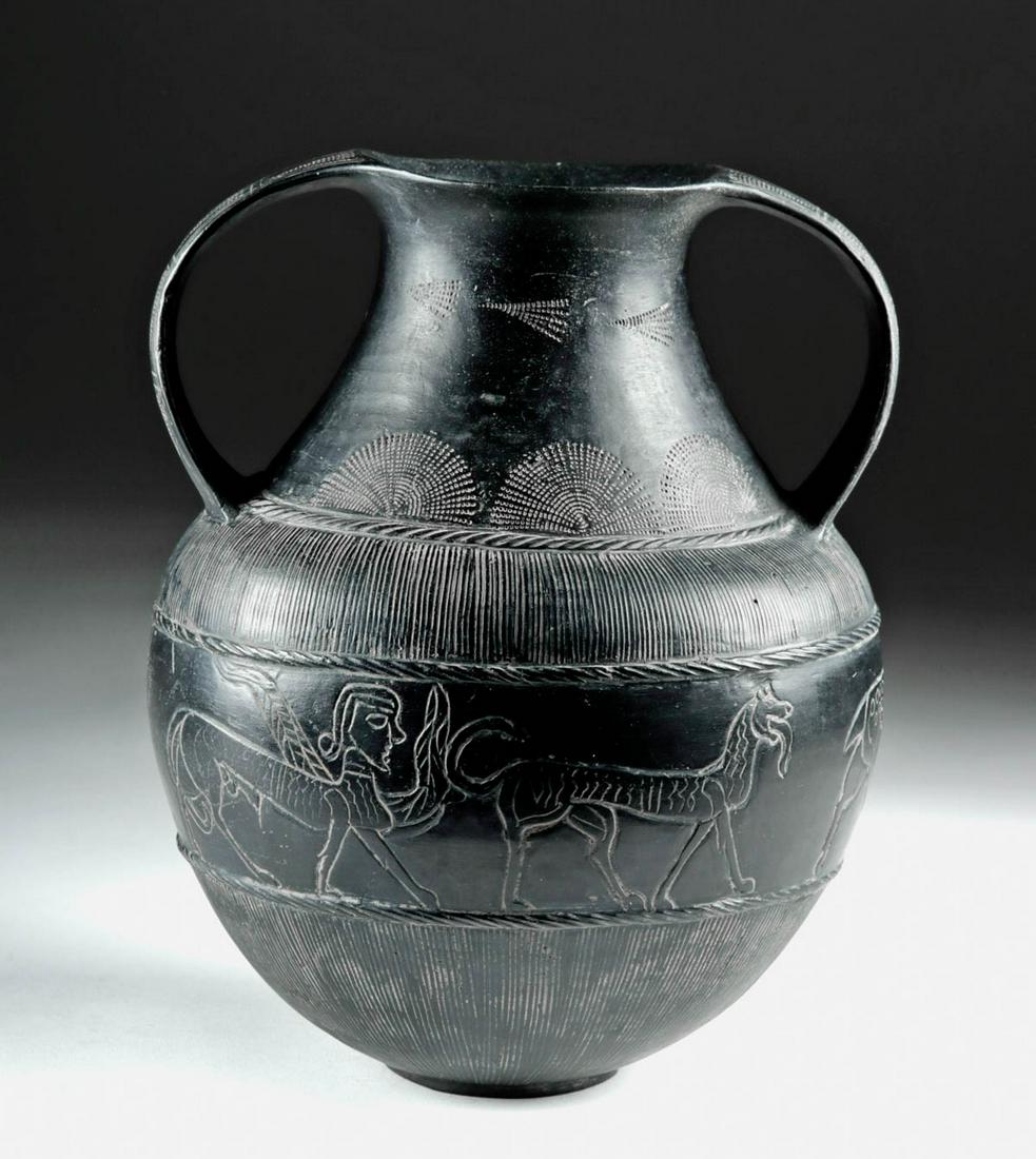 Etruscan Bucchero Amphora w/ Animals, ex-Christie's: Northern Italy, Etruscan, late 7th century BCE. An outstanding Etruscan bucchero amphora with an extensive and very refined graffiti decorative program comprised of six feather-like motifs around the 
