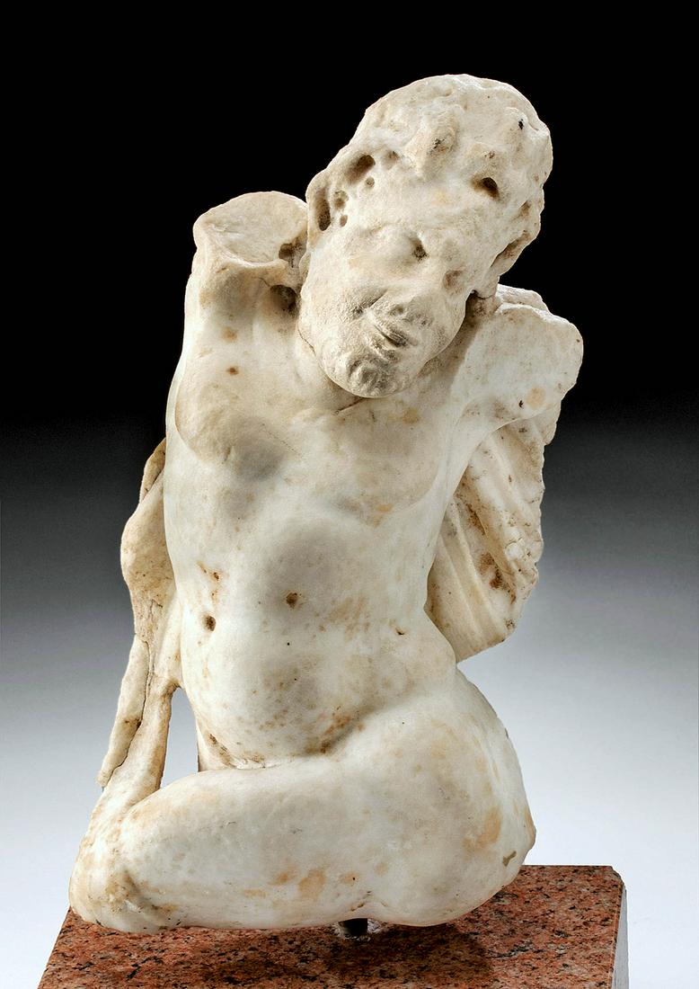 Roman Marble Statue of Pan, ex-Sotheby's: Roman, Imperial Period, ca. 2nd century CE. A stunning marble sculpture of Pan, the Roman satyr god of the pastoral and wild, known for his oenophilia, salacious behavior, and affection for wood nymph