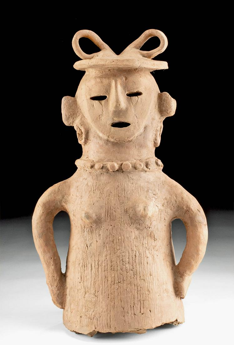 Japanese Kofun Terracotta Haniwa Female Figure w/ TL: East Asia, Japan, Kofun Period, ca. 4th century CE. An impressive and rare handmade terracotta bus of a female figure with her hands placed on her hips. The fascinating figure presents a cylindrical b