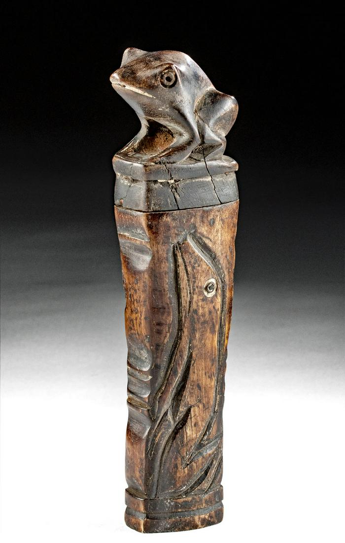 20th C. Dayak Bone Drug Container w/ Frog Lid: Indonesia, Borneo, Central Kalimantan, Dayak peoples, ca. early 20th century CE. A fascinating container carved from the bone of an ungulate with a carved wood lid in the form of a seated frog and a w