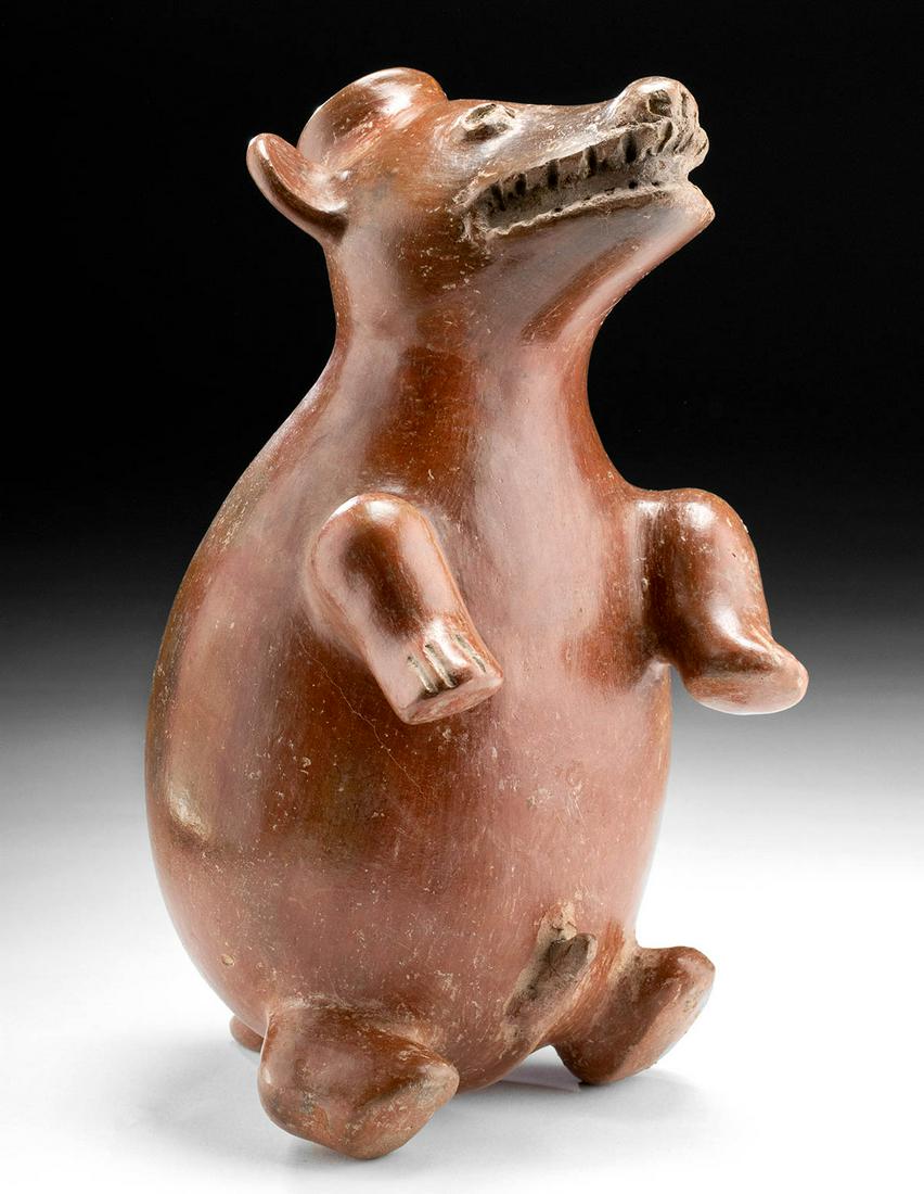Colima Redware Vessel Dog Upright / Playful: Pre-Columbian, West Mexico, Colima, Protoclassic Period, ca. 100 BCE to 250 CE. A charming redware dog effigy vessel of a sizeable form and beautifully stone-burnished, creating a lustrous effect. The