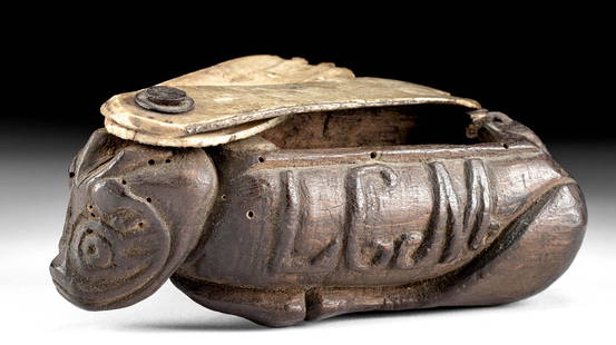 19th C. American Wood & Bone Box: North America, United States, ca. 19th century CE. A hand-carved wooden box in a zoomorphic form with two bovine or ungulate bone lids that swivel on an iron nail. The box is in the form a bull lying