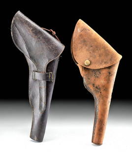 19th C. American Leather Pistol Holsters (pr): North America, United States, ca. late 19th century CE. A pair of tanned leather pistol holsters meant to be affixed to a belt via vertical strap loops on the verso. The first holster is of a