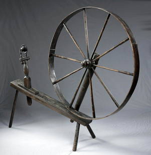 Early 19th C. American Wooden Walking Wheel: North America, United States, ca. first half of the 19th century CE. A hand-carved walking spinning wheel (also known as a great wheel) of an enormous form with a slanted base supported by three