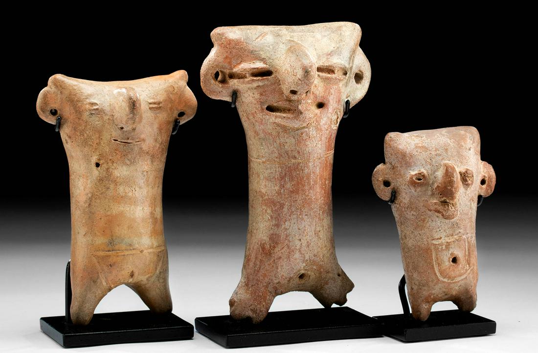 Lot of 3 Vicus Pottery Figures of Family by Same Hand: Pre-Columbian, Northern Peru, Vicus culture, ca. 500 to 200 BCE. A wonderful trio of buff earthenware, characteristically abstract, anthropomorphic votive figures, each with appliqued, perforated, and