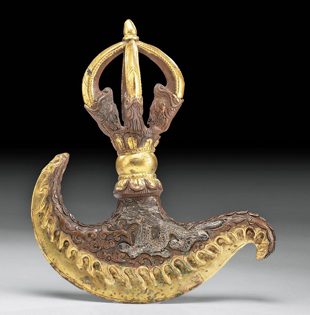 18th C. Tibetan Gilt Brass & Silver Kartika Dorje: Central Asia, Tibet, ca. 18th to 19th century CE. A fine kartika, a ritualistic flaying knife, with a gilt brass dorje handle, silver adornments, and a curved blade. The openwork dorje is a ritual obj