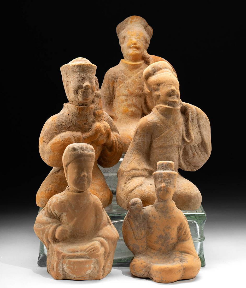 5 Chinese Han Seated Tomb Attendants, TL Tested: East Asia, China, Han Dynasty, ca. 206 BCE to 220 CE. A superb gathering of five mold-formed pottery tomb attendants dressed in elegant garments that cover everything but their heads and hands. The fi