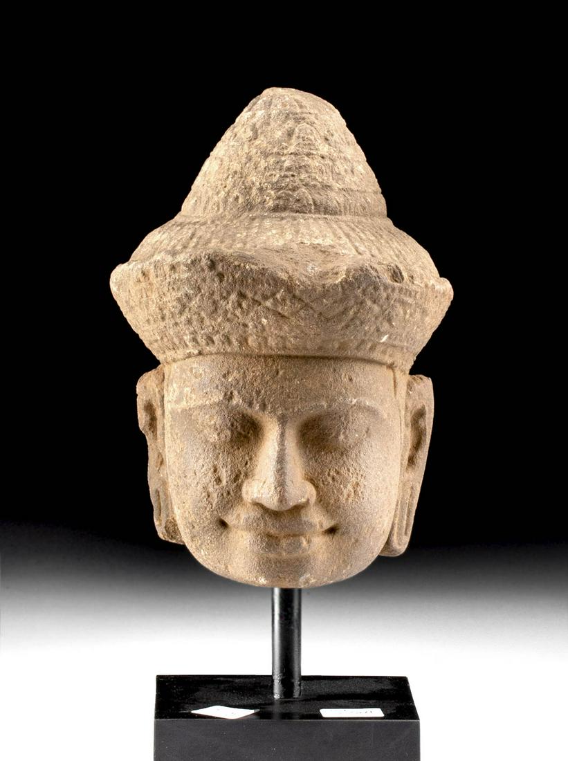 12th C. Khmer Angkor Stone Buddha Head: Southeast Asia, Cambodia, Khmer Empire (Angkor culture), ca. late 12th to early 13th century CE. A handsome, well-preserved, stone head of Buddha. Buddha's face is serene, with a naturalistic and warm
