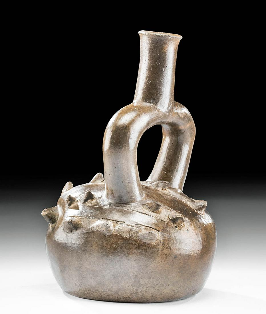 Chavin Pottery Spondylus Shell Stirrup Vessel w/ TL: Pre-Columbian, North Coast Peru, Chavin, ca. 700 to 500 BCE. A beautiful pottery vessel, its body modeled to depict a spondylus shell delineated with four rows of pointy spikes emerging from its surfa
