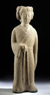 Chinese Tang Dynasty Stone Sculpture of Woman: East Asia, China, Tang Dynasty, ca. 618 to 907 CE. A rare example of a stone carving depicting a woman of the court dressed in the height of fashion. She wears a stylish V-necked gown belted at the