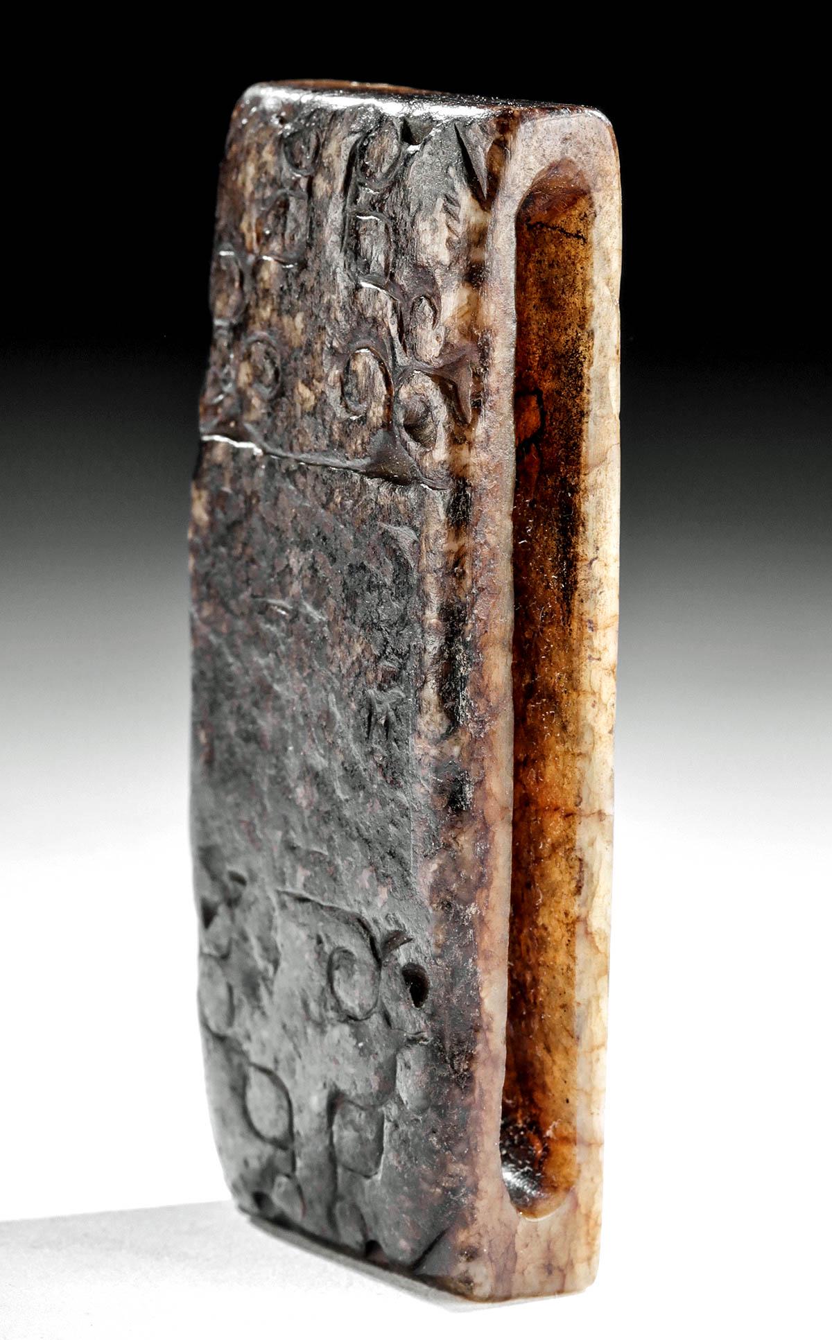 Chinese Ming Dynasty Jade Scabbard Slide 2 Tigers: East Asia, China, probably Ming Dynasty, ca. 1368 to 1644 CE. A wide, handsome scabbard slide, made from a richly banded dark and light brown nephrite jade. On its face is a relief of two tiger faces,
