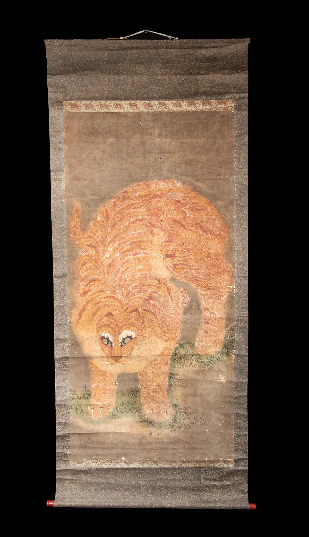 Early 20th C. Korean Scroll Painting w/ Tiger: East Asia, Korea, early 20th century. Hand painted on buff paper, a dramatic depiction of a tiger with a thick coat of tawny orange fur, perhaps inspired by a famous painting of a "Ferocious Tiger" cr