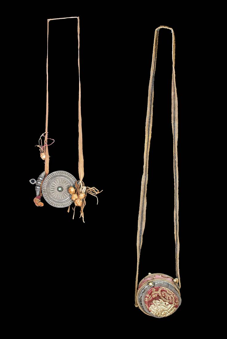 Pair of 20th C. Tibetan Copper & Silver Prayer Boxes: Central Asia, Tibet, ca. first half of the 20th century CE. Two marvelous gau prayer boxes used as a personal shrine for traveling practitioners of Tibetan Buddhism. Both featuring discoid forms, one