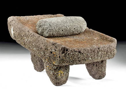 Attractive Maya Stone Metate & Pestle: Pre-Columbian, Maya Territories, Maya, ca. 200 to 900 CE. A wonderful metate and pestle, both carved from stone and enveloped in natural hues of umber, sienna, taupe, light grey, and puce. The pair bo