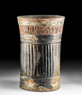 Maya Pottery Cylinder Vessel Glyph Band: Pre-Columbian, Guatemala and southern Mexico, Maya, ca. 550 to 900 CE. A sizable handbuilt, terracotta, cylinder vessel with fluted walls framed by upper and lower horizontal bas relief bands, an