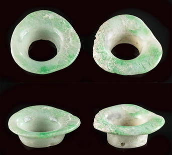 Lot of 2 Maya Jade Ear Spools: Pre-Columbian, Southern Mexico to Guatemala, Maya, Late Classic Period, ca. 550 to 900 CE. A beautiful and perhaps wearable pair of apple-green jade earspools carved by hand in a characteristic