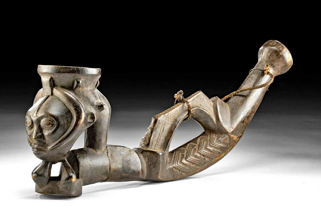 19th C. African Kuba Figural Wood Pipe: Central Africa, Dominican Republic of Congo, Kuba peoples, ca. late 19th to early 20th century CE. A stunning, hand-carved, wooden pipe used for smoking tobacco displaying a stylized bowl in the form 
