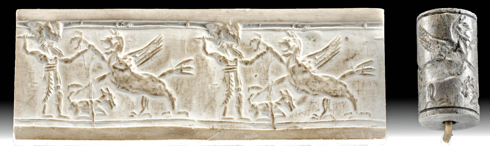 Achaemenid Stone Seal Bead - God Fighting Anzu: Ancient Near East, Achaemenid Persian Empire, ca. 500 to 330 BCE. A large, grey steatite stamp seal depicting a classically Achaemenid scene: a god battles a mythical beast while a goat sits at his fe