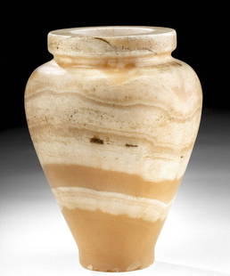 Stunning / Large Egyptian Banded Alabaster Jar: Egypt, Late Dynastic to Ptolemaic Period, ca. 664 to 30 BCE. A beautiful vessel of an elegant form and a generous size, hand-carved from banded alabaster with ample natural veining in warm hues of