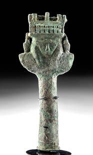 Romano-Egyptian Bronze Sistrum Handle Double Hathor: Egypt, Romano-Egyptian period, ca. 30 BCE to 2nd century CE. A lovely example of a bronze sistrum handle with rich decoration, featuring a long cylindrical column for gripping that rises to meet a