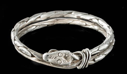 9th C. Viking Silver Bracelet Twisted Snake: Northern Europe, Viking / Norse culture, ca. 9th to 10th century CE. Northern Europe, Viking or Norse culture, ca. 8th to 11th century CE. A beautiful double-banded bracelet formed from a single